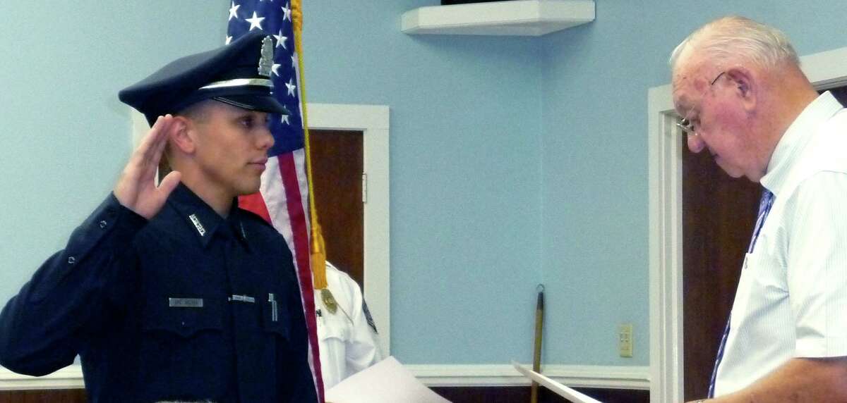 In this file photo, Alexander Relyea is sworn in as a New Milford police officer in July 2012. He joined the Danbury Police Department two years later.
