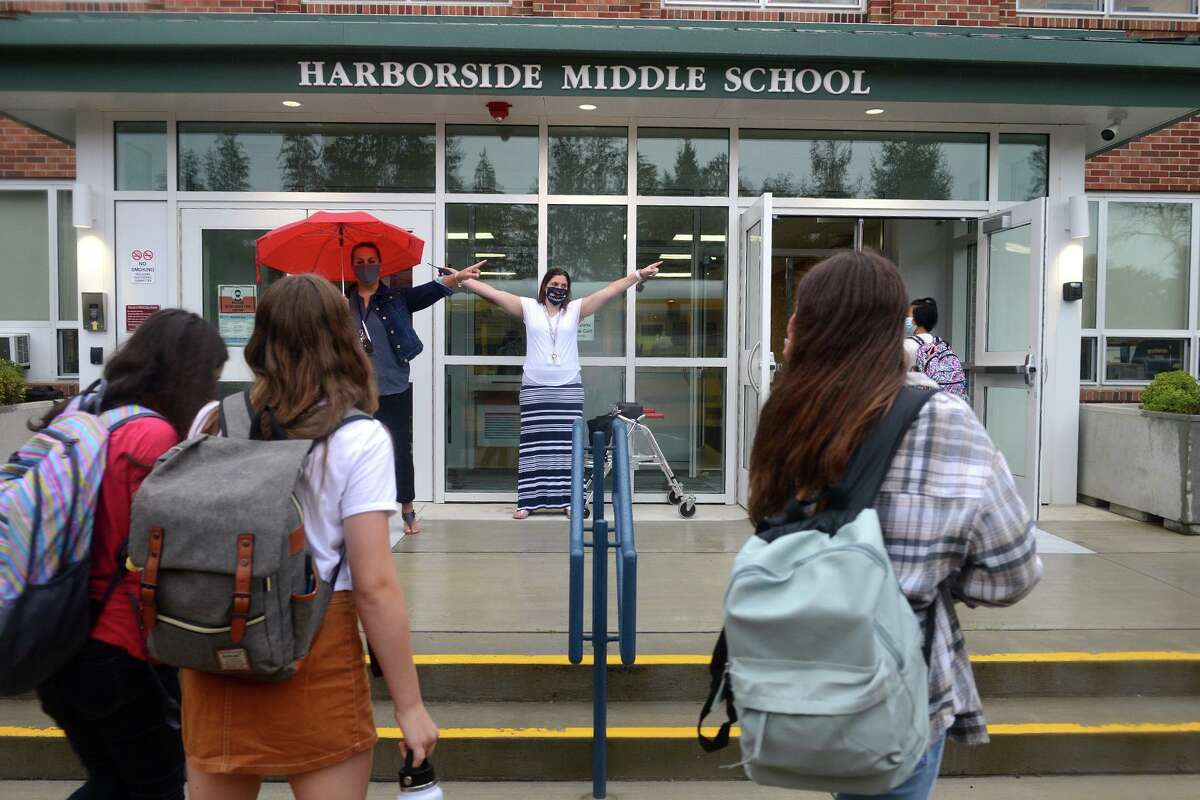 Students arrive for the first day of class at Harborside Middle School, in Milford, Conn. Sept. 1, 2021.