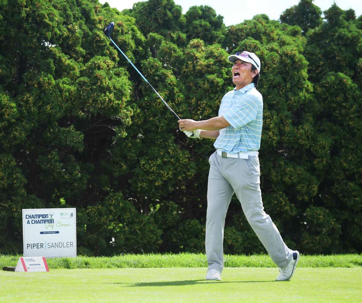 Former New York Yankees baseball player Hideki Matsui shouts after hitting his tee shot at the Champion a Champion Golf Classic at Tamarack Country Club in Greenwich, Conn. Monday, Sept. 20, 2021. The celebrity golf outing was a joint fundraiser between Greenwich-based non-profit Global Citizens Initiative and Hideki Matsui's non-profit Matsui 55 Baseball Foundation.