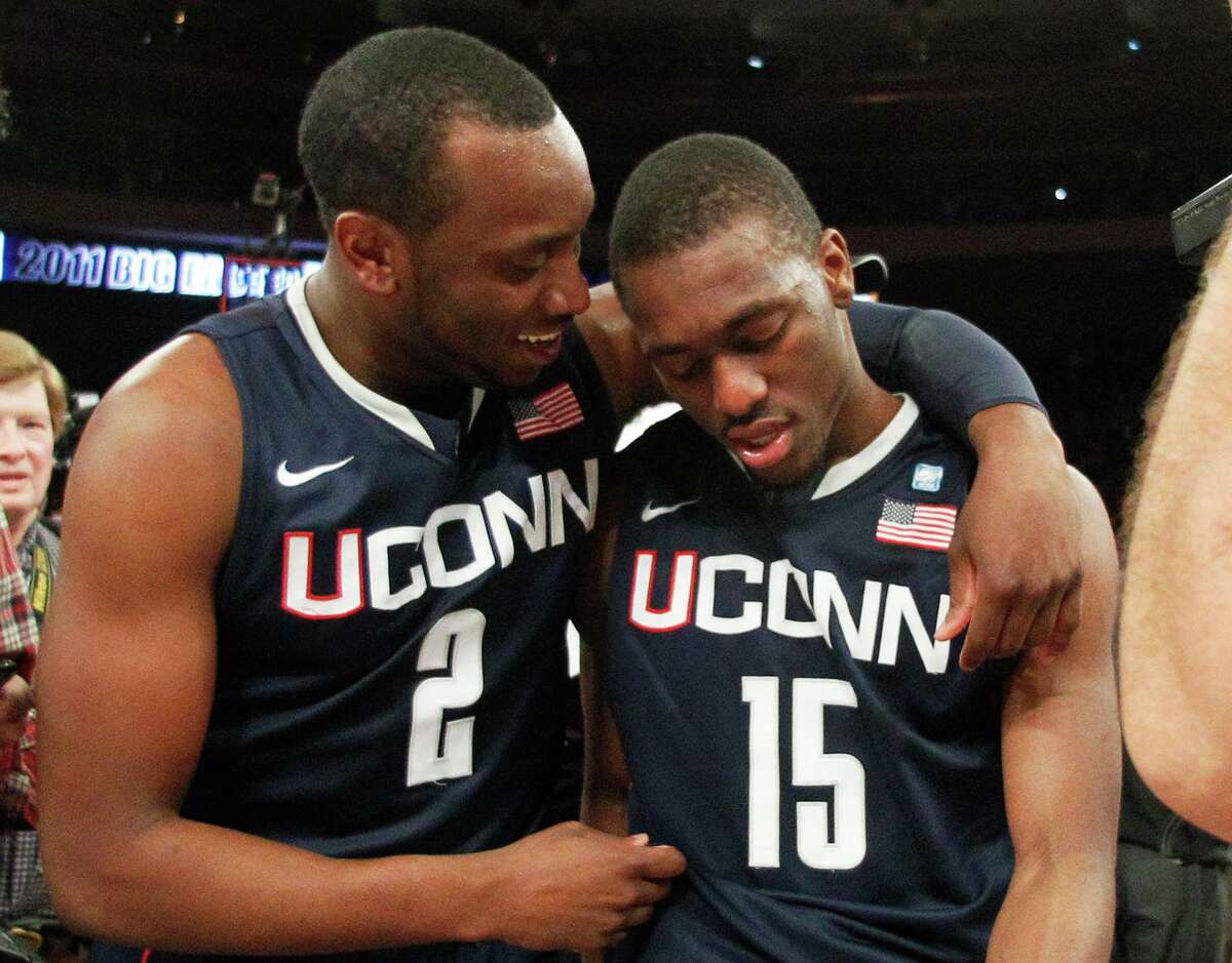 UConn’s Donnell Beverly (2) celebrates with teammate Kemba Walker after their victory over Louisville in the Big East Tournament championship game in 2011.