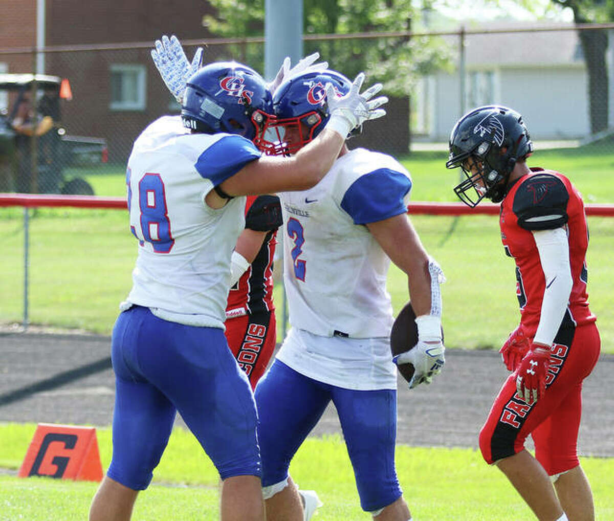 Carlinville’s Carson Wiser (middle) is congratulated by a teammate after making a touchdown catch in a Week 1 win at Gibson City. On Friday, the Cavs were at home and beat Staunton to improve to 4-1.