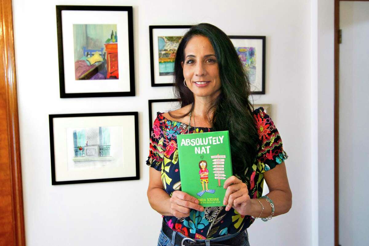 Author Maria Scrivan poses ahead of the release of her third book: "Absolutely Nat" at her home in Greenwich, Conn., on Friday September 17, 2021.