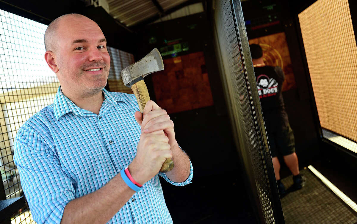 Chris Resnick throws an axe at Big Dog's Mobile Axe Throwing as patrons celebrate Locktoberfest at Lock City Brewing Co. Saturday, September 25, 2021, in Stamford, Conn.