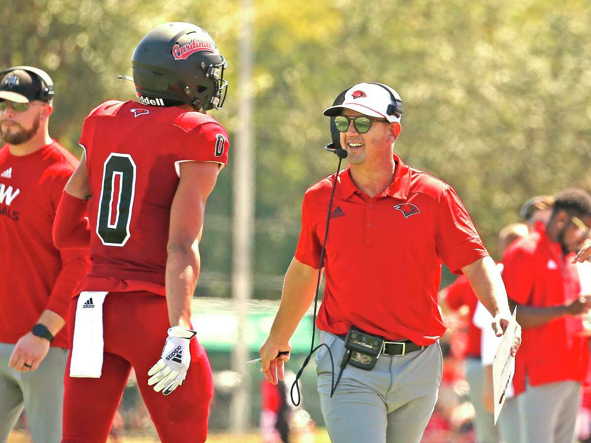 UIW coach Eric Morris congratulates his team during a game against McNeese on Sept. 25. The Cardinals will face the Cowboys next week.