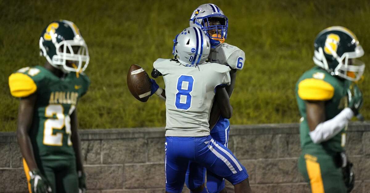Willowridge (6) Marxquise Hayes celebrates his overtime touchdown with (8) Javin Chatman during game against Sharpstown at Delmar Stadium Saturday, Sept. 25, 2021 in Houston.
