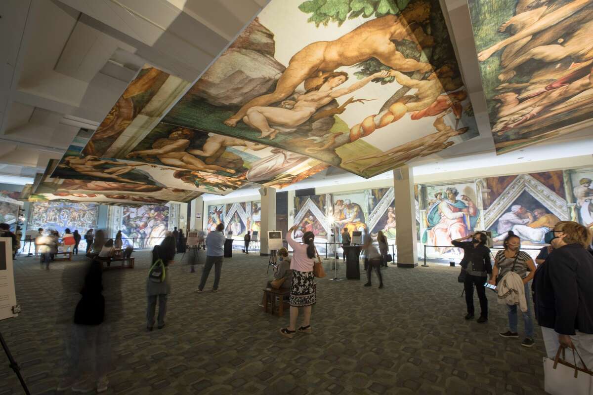 Visitors see a new art installation recreating the Sistine Chapel for an exhibition at St. Mary's Cathedral in San Francisco on September 24, 2021.