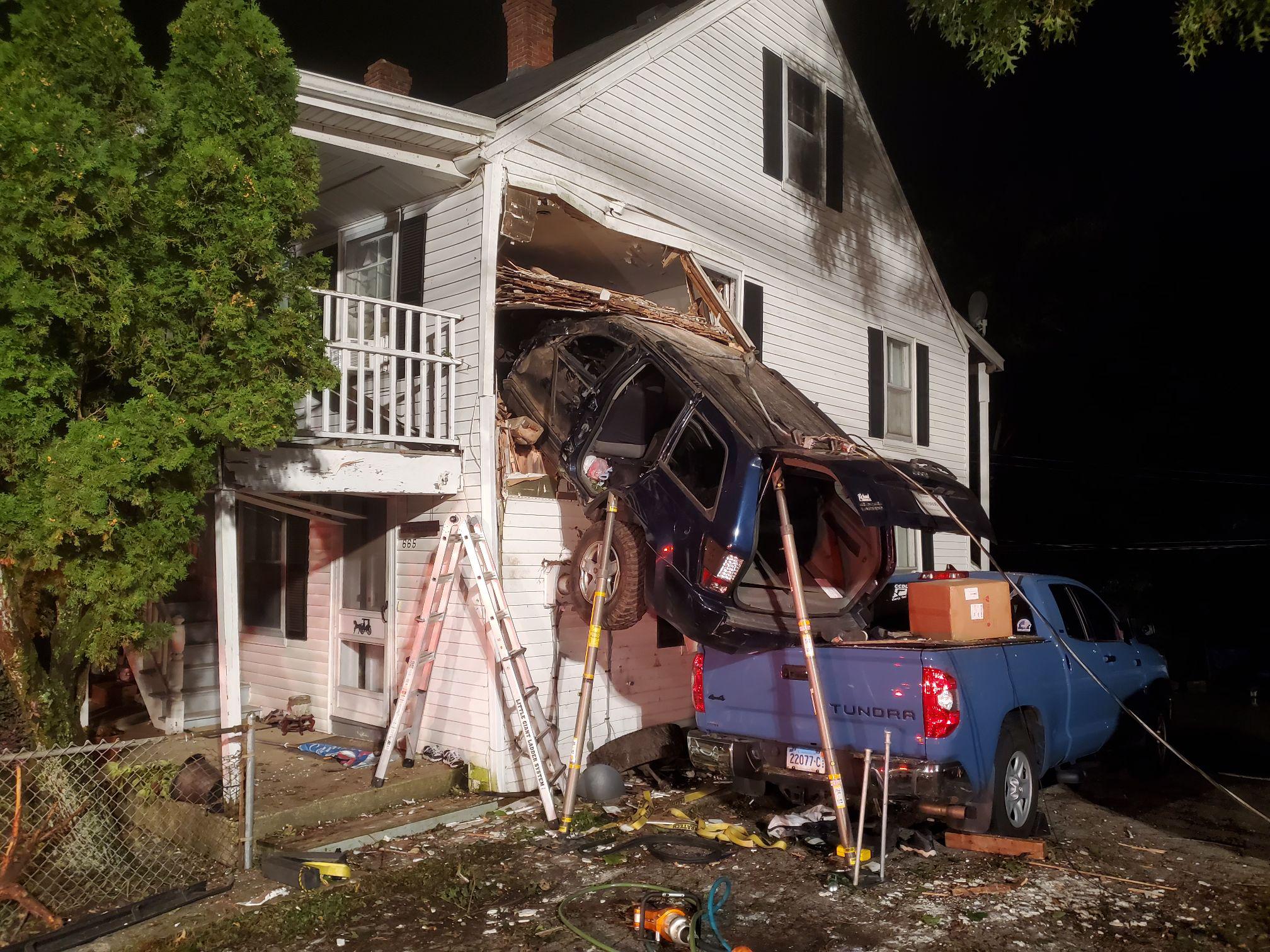 Officials: Car crashes into second story of Norwich family home