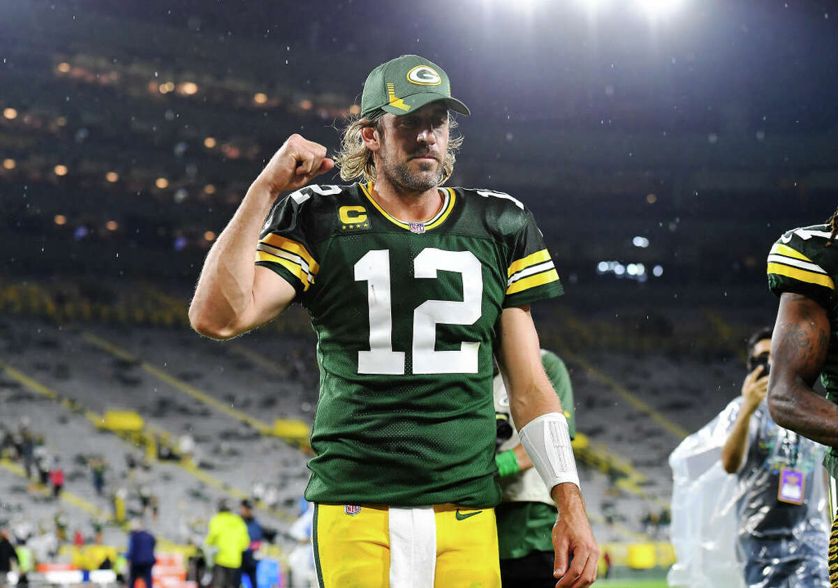 Aaron Rodgers of the Green Bay Packers reacts as he walks of the field following the team's win against the Detroit Lions during an NFL football game at Lambeau Field on September 20, 2021 in Green Bay, Wisconsin. 