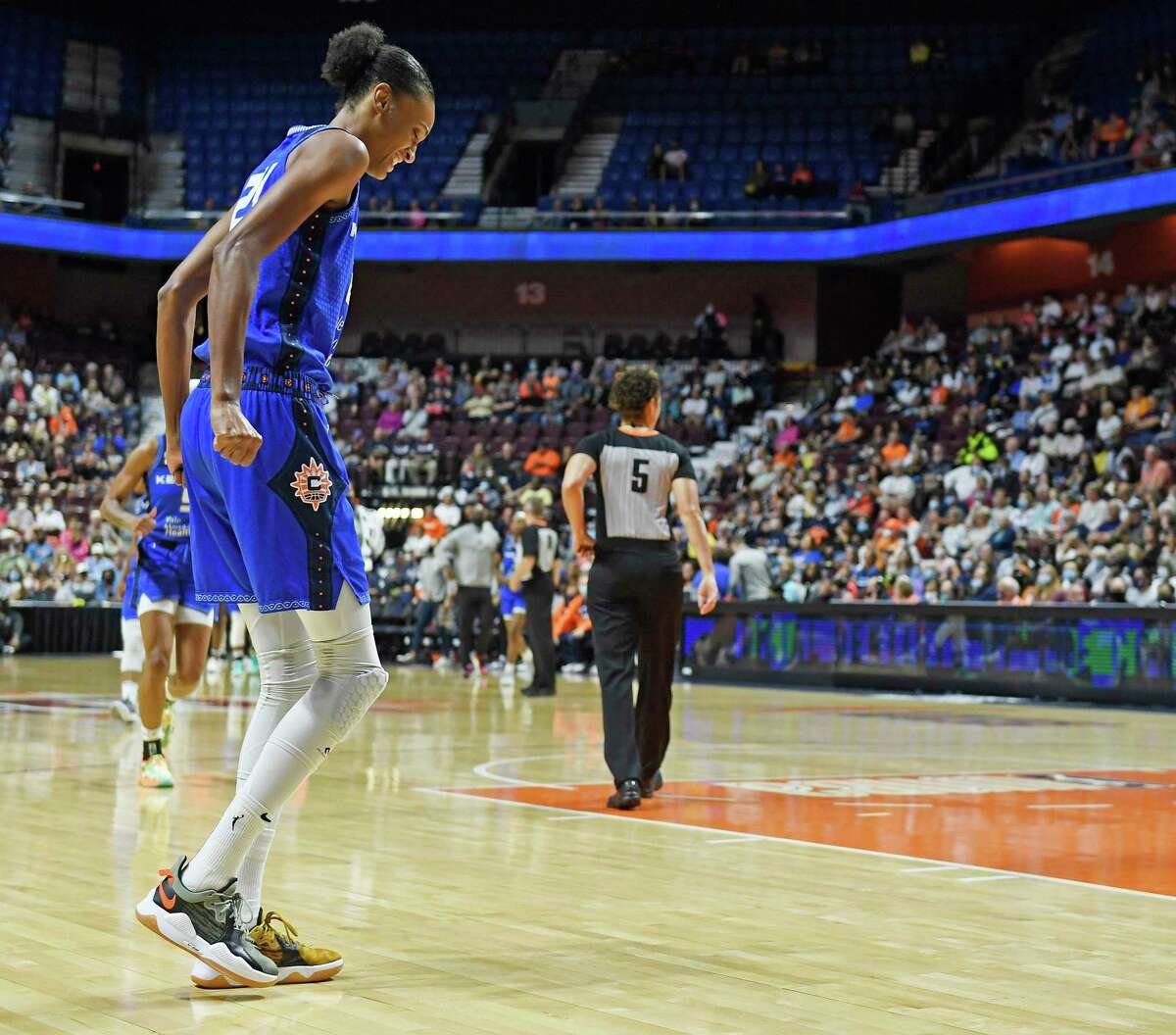 Connecticut Sun forward DeWanna Bonner limps toward the sideline after injuring her back early in the game against the Atlanta Dream in WNBA basketball action Sunday, Sept. 19, 2021 at Mohegan Sun Arena in Uncasville, Conn. (Sean D. Elliot/The Day via AP)