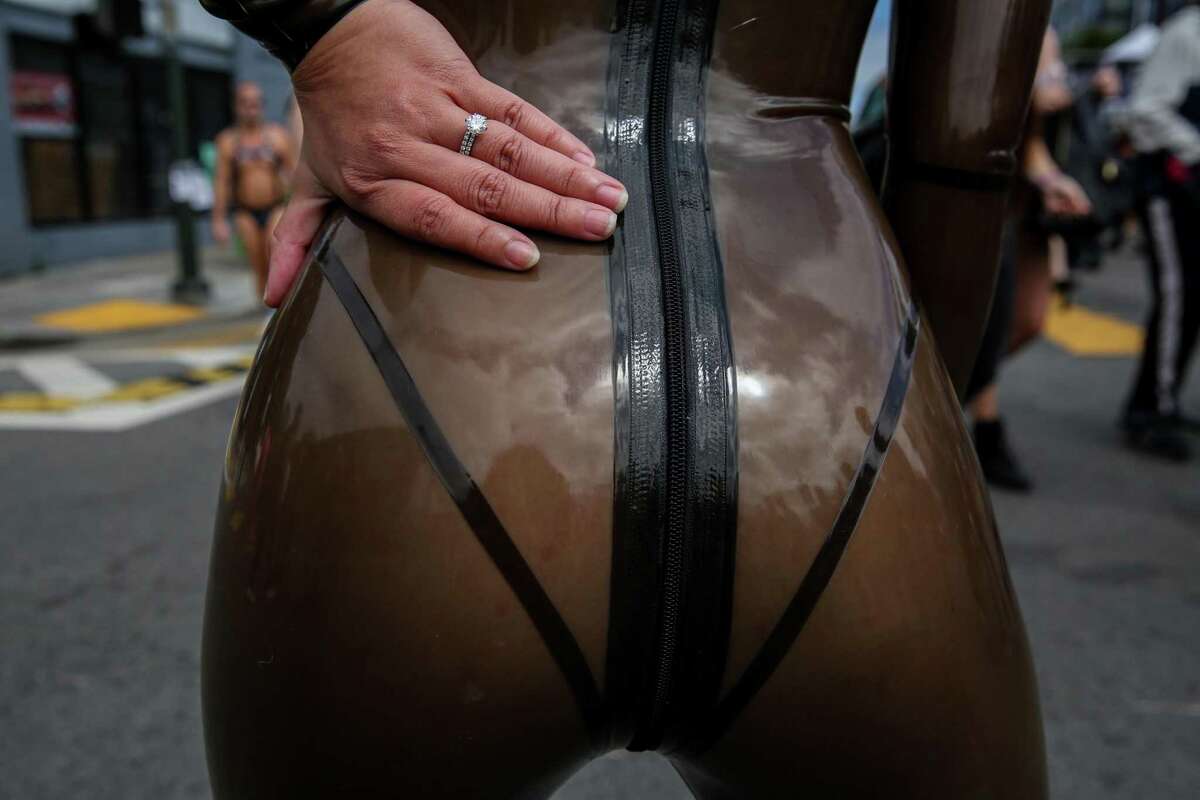 A woman using the name Miss Mia Mai of Dallas wears a latex suit to the Folsom Street Fair.