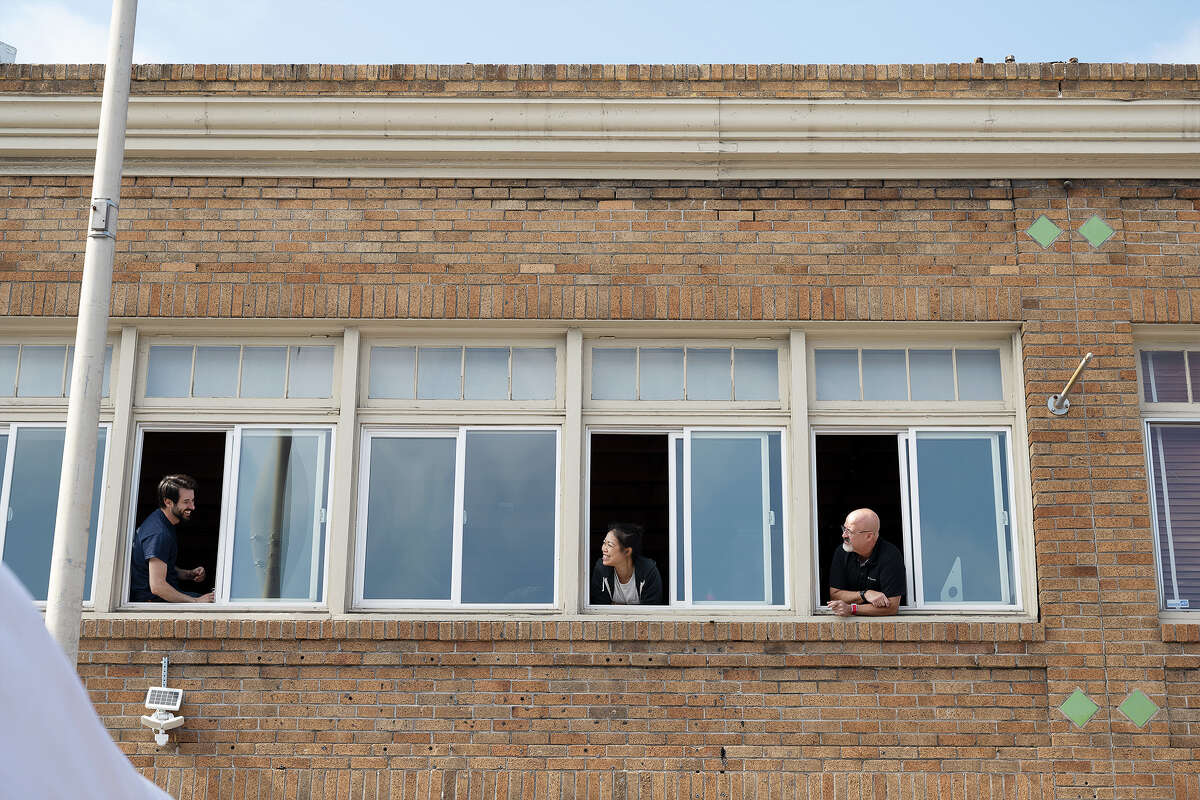 Spectators enjoying the Folsom Street Fair 2021 from up high in San Francisco, Calif. on Sept. 26, 2021.