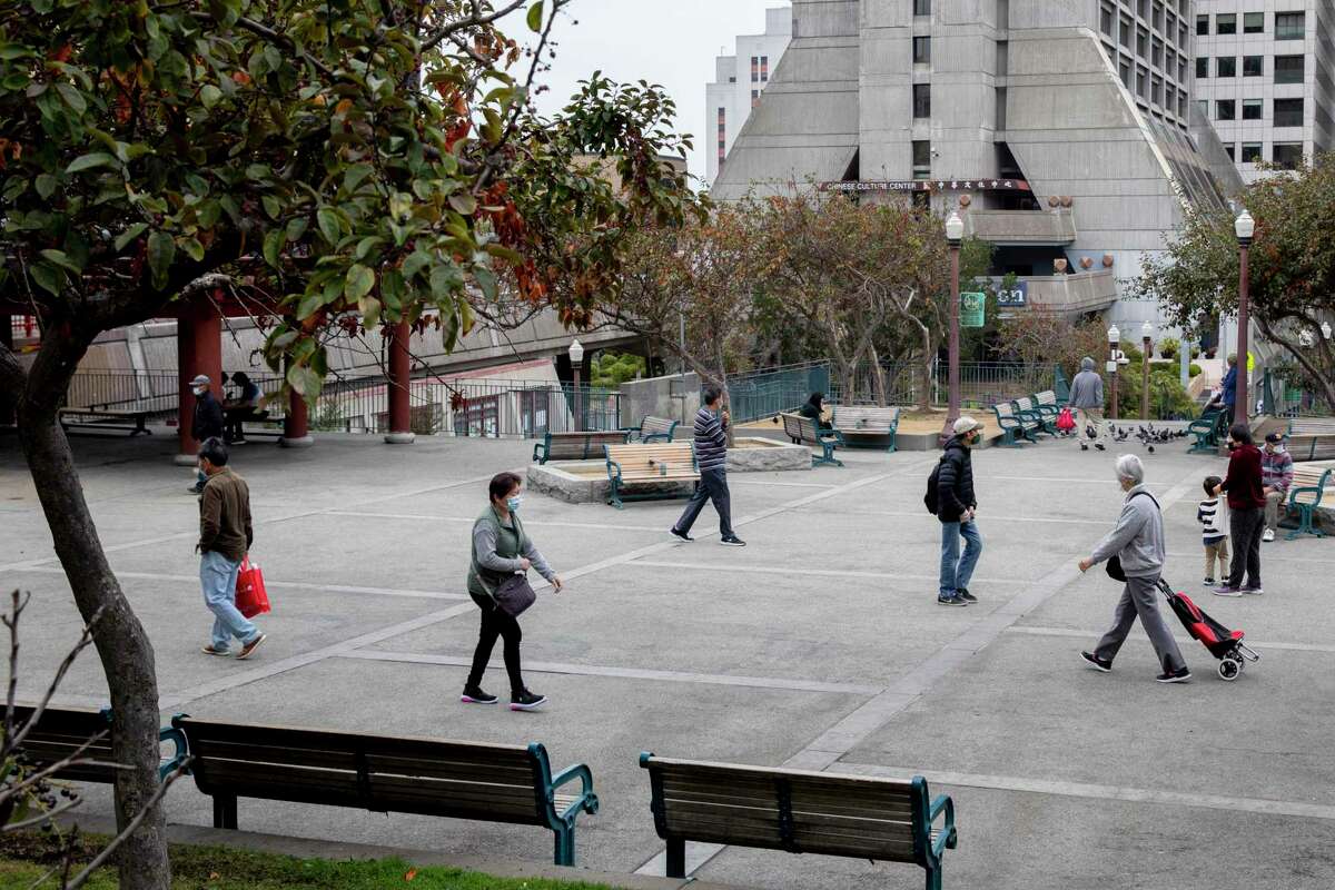 People walk through the main area of Portsmouth Square in San Francisco.