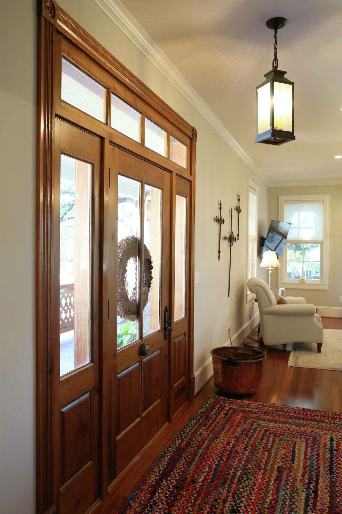 The front door, trim and flooring are made from reclaimed longleaf pine.