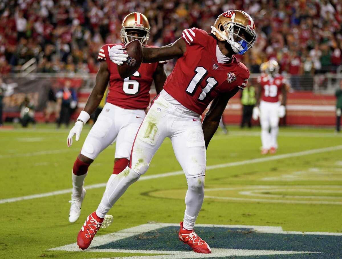 SANTA CLARA, CALIFORNIA - SEPTEMBER 26: Brandon Aiyuk #11 of the San Francisco 49ers celebrates after catching a touchdown pass during the third quarter against the Green Bay Packers in the game at Levi's Stadium on September 26, 2021 in Santa Clara, California. (Photo by Thearon W. Henderson/Getty Images)