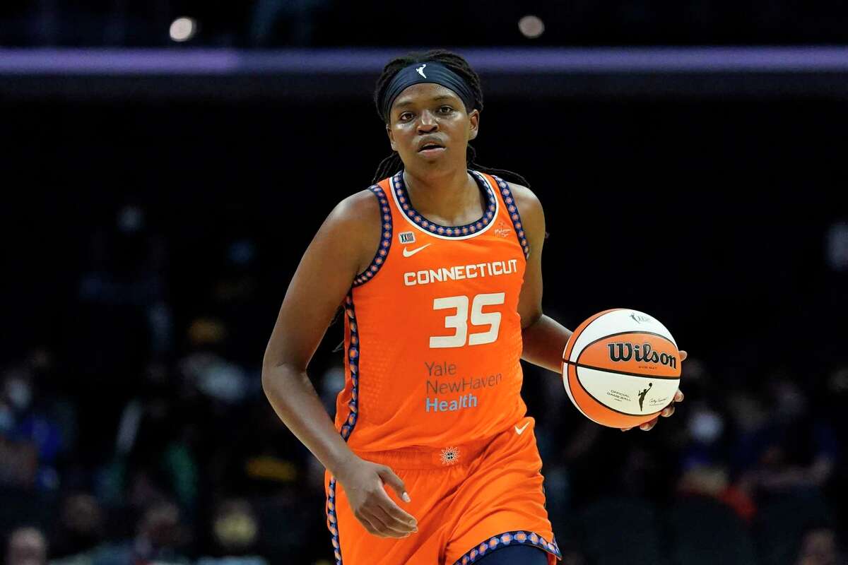 FILE - Connecticut Sun forward Jonquel Jones (35) controls the ball during the first half of a WNBA basketball game against the Los Angeles Sparks in Los Angeles, in this Thursday, Sept. 9, 2021, file photo. Jonquel Jones is no stranger to winning Associated Press WNBA awards. In previous years, the Connecticut Sun forward has been honored by the media that votes on the weekly AP WNBA power poll as the Sixth Woman of the Year and Most Improved Player. This year, the 6-foot-6 Jones is the unanimous choice AP Player of the Year honors by the 14-member panel, announced Wednesday, Sept. 22, 2021. (AP Photo/Ashley Landis, File)