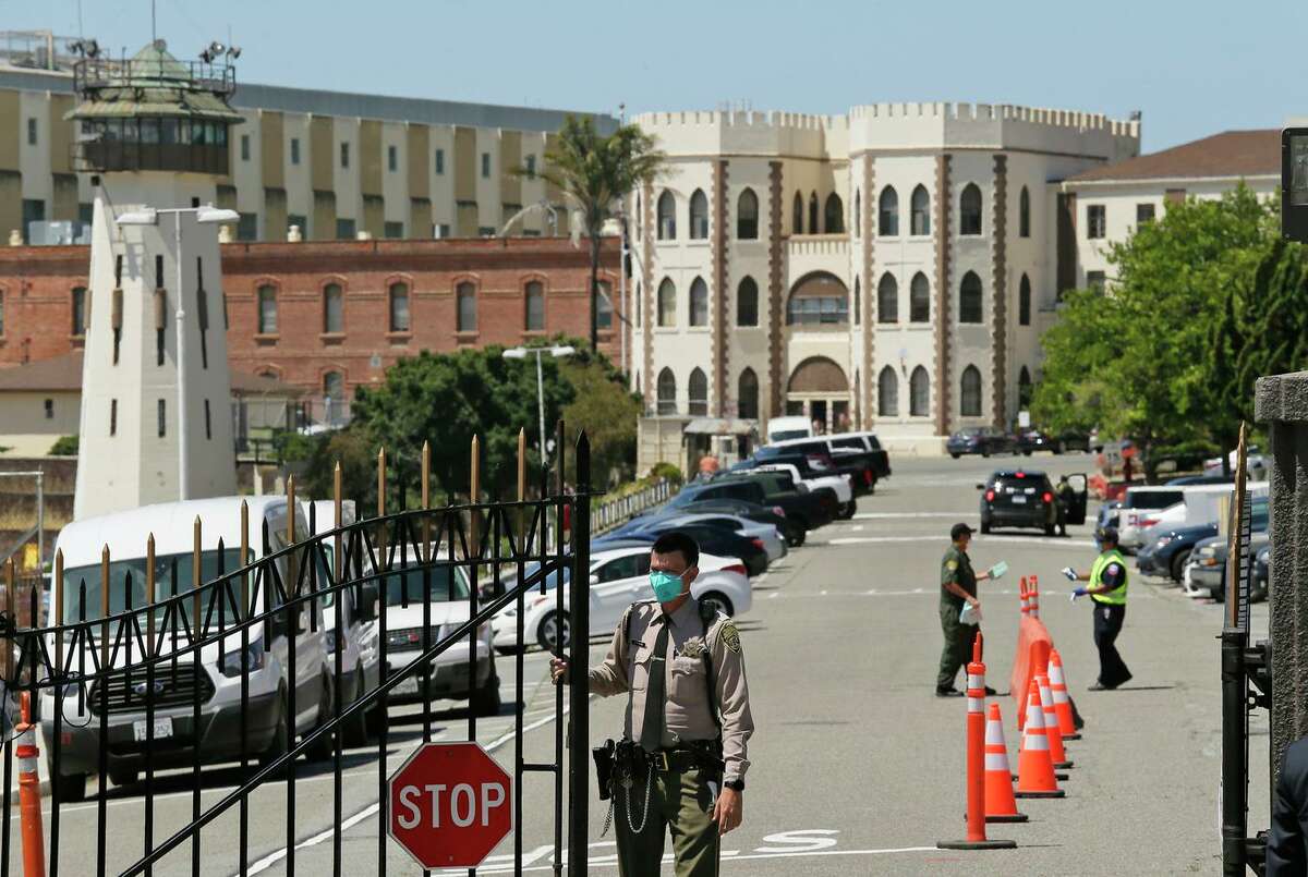 A federal judge has ordered that all state prison employees and inmates who work in public areas be vaccinated to prevent outbreaks like the one at San Quentin, above, last summer.