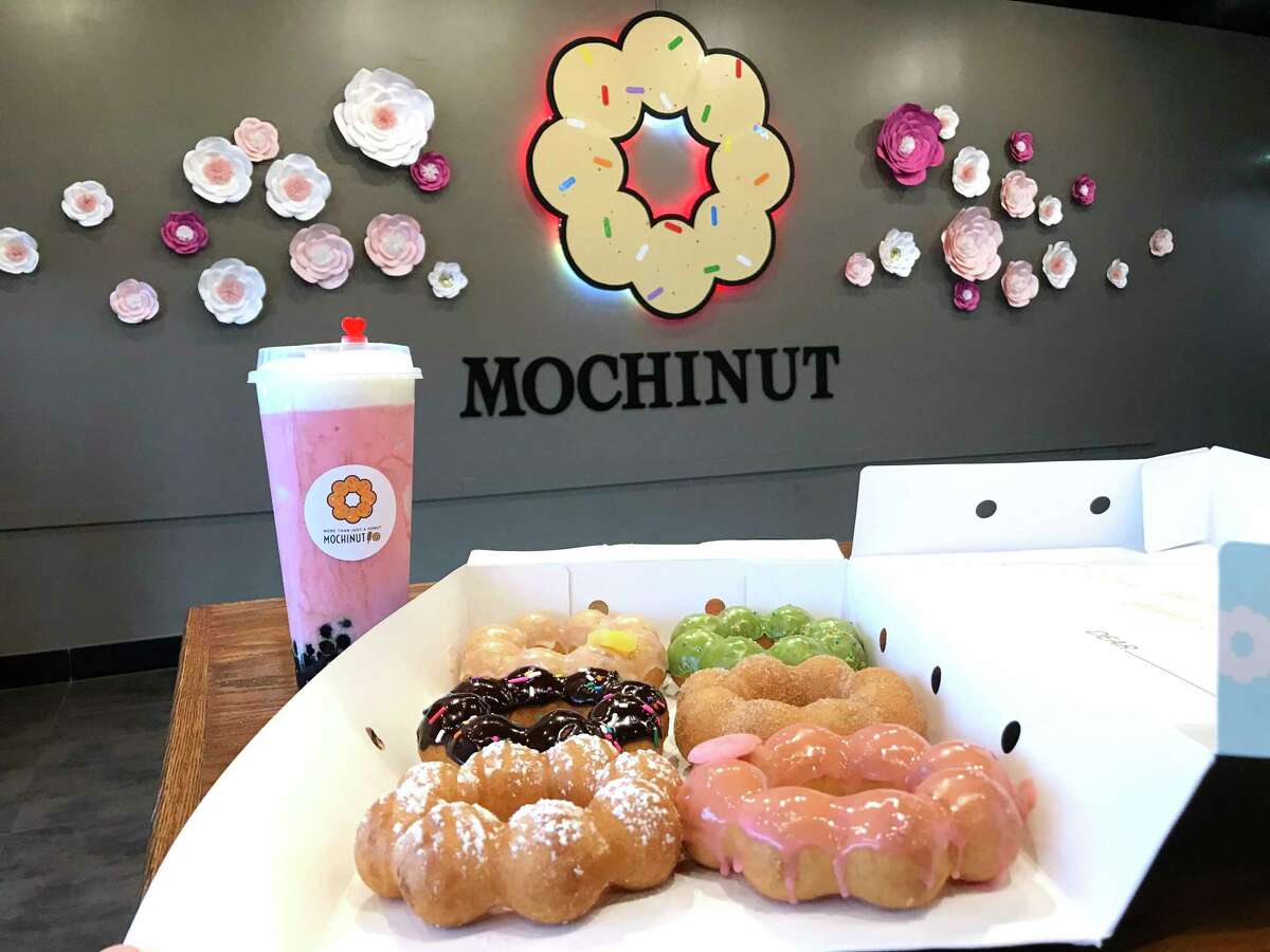A selection of doughnuts and a strawberry cheese smoothie from Mochinut