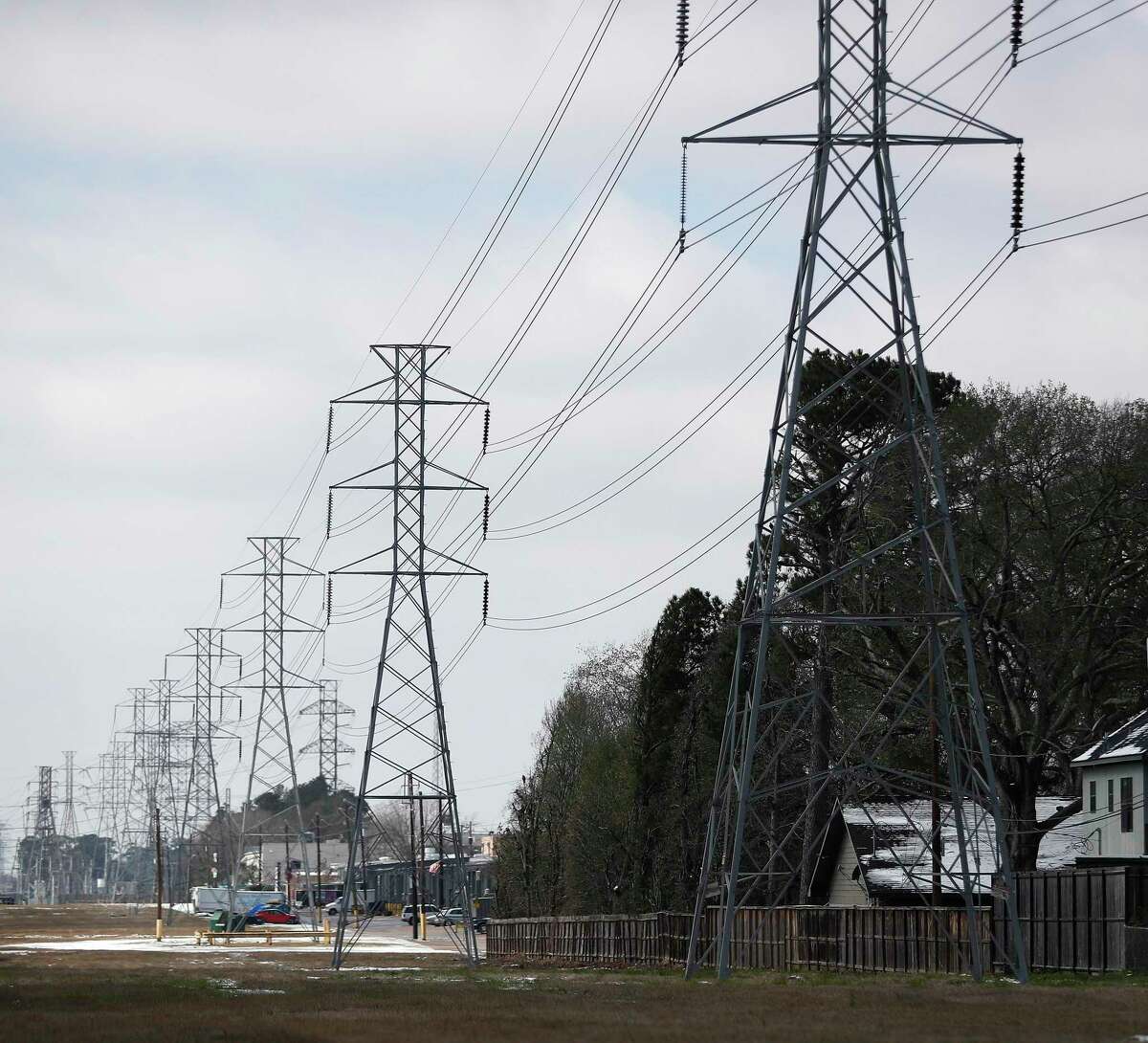 Power lines cut through the Shepherd Forest subdivision, in Houston, Monday, February 15, 2021, after a winter storm with freezing rain and temperatures created a strain on the power grid, leaving 2.3 million Texas residents without power.