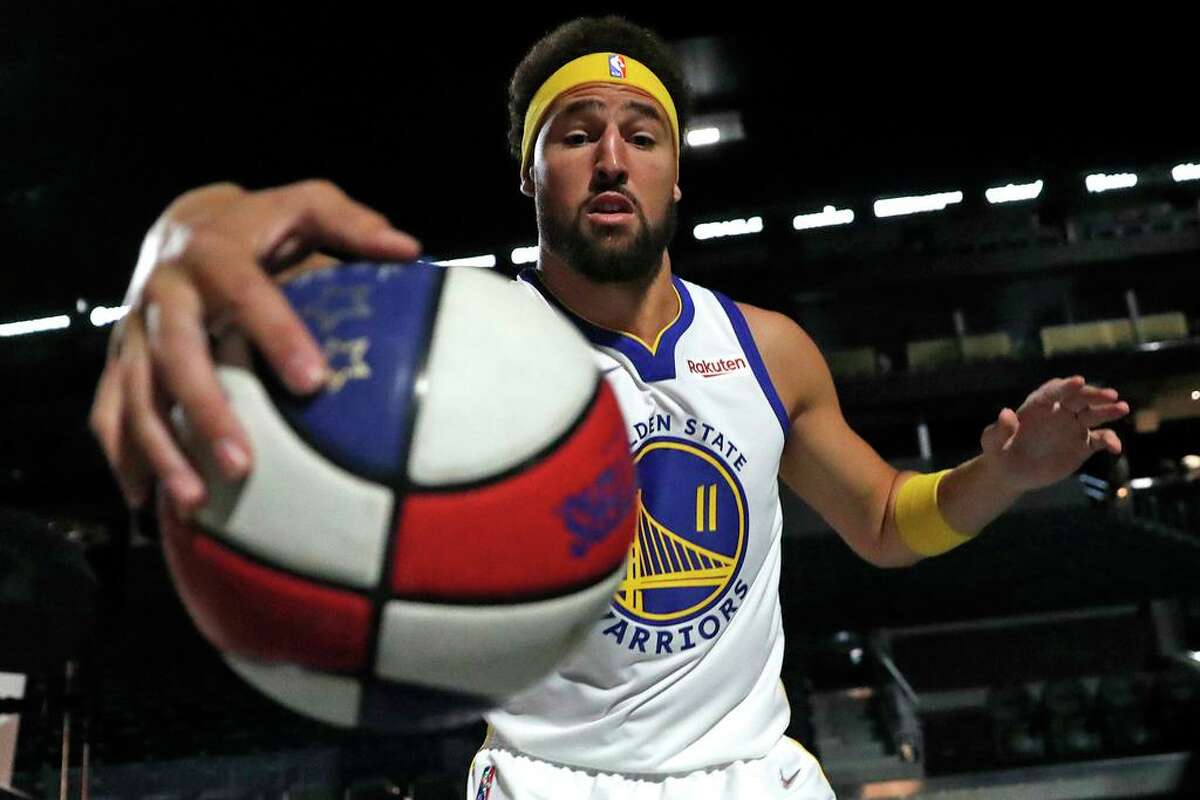 Golden State Warriors' Klay Thompson plays around during Monday’s media day at Chase Center.