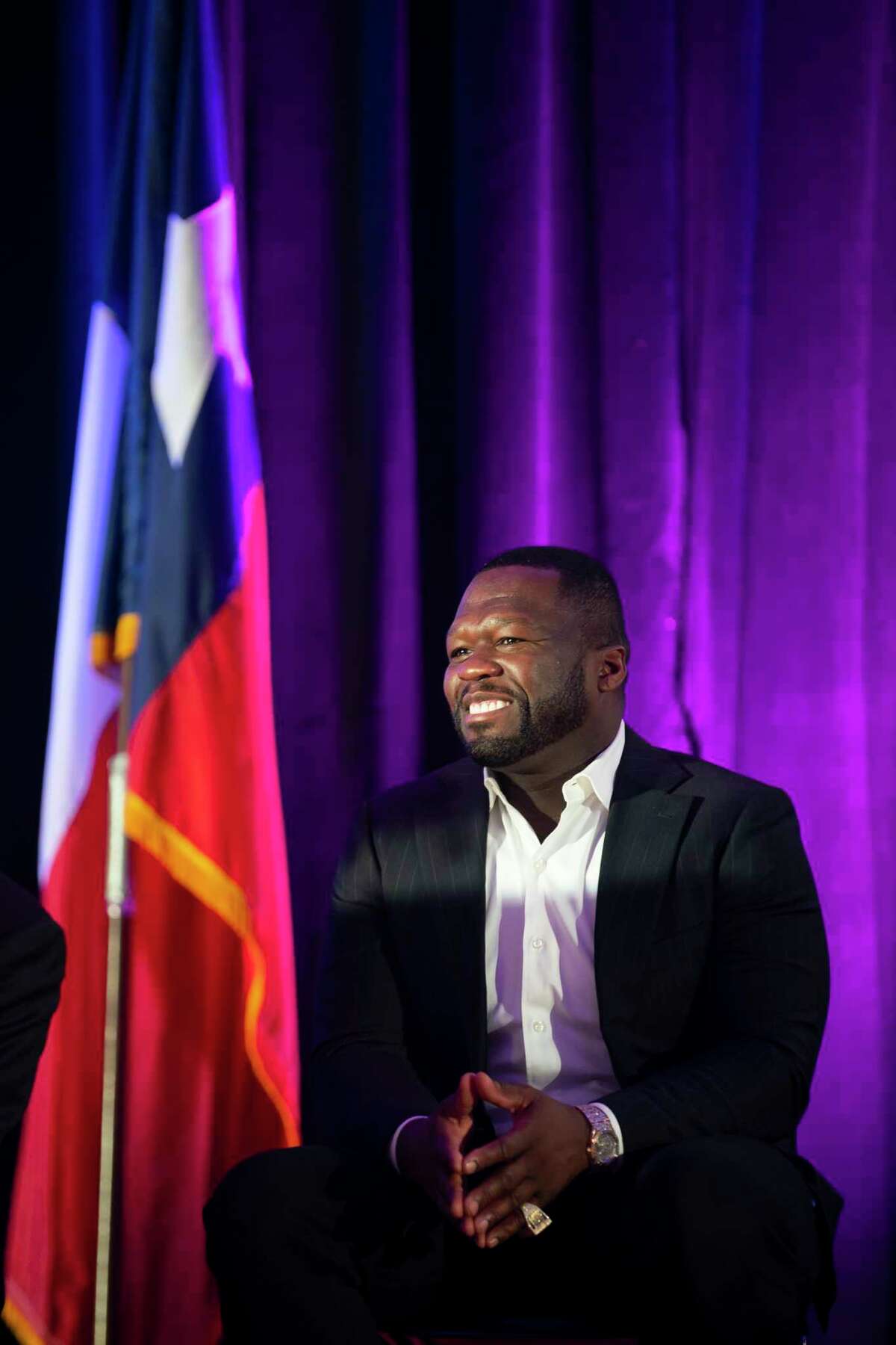 Curtis "50 Cent" Jackson listens during the induction ceremony for the G-Unity Business Lab, Monday, Sept. 27, 2021, at Wheatley High School in Houston. The initiative is a partnership between Curtis "50 Cent" Jackson's G-Unity Foundation and Houston Independent School District. The business lab will offer MBA-style business classes for students interested in entrepreneurial endeavors.