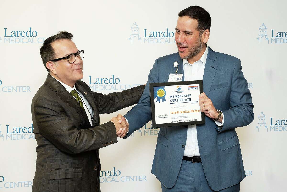 Laredo Chamber of Commerce Boardmember Gabriel Castillo presents a membership certificate to Laredo Medical Center CEO Jorge Leal for the new Infusion Center, Monday, Sept. 27, 2021, at LMC.
