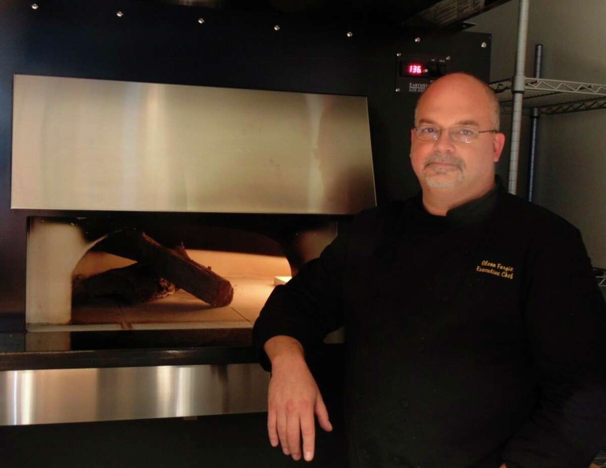 Chef and general manager, Glenn Forgie, fires up the new pizza oven which will be used at the restaurant. (Star photo/Shanna Avery)