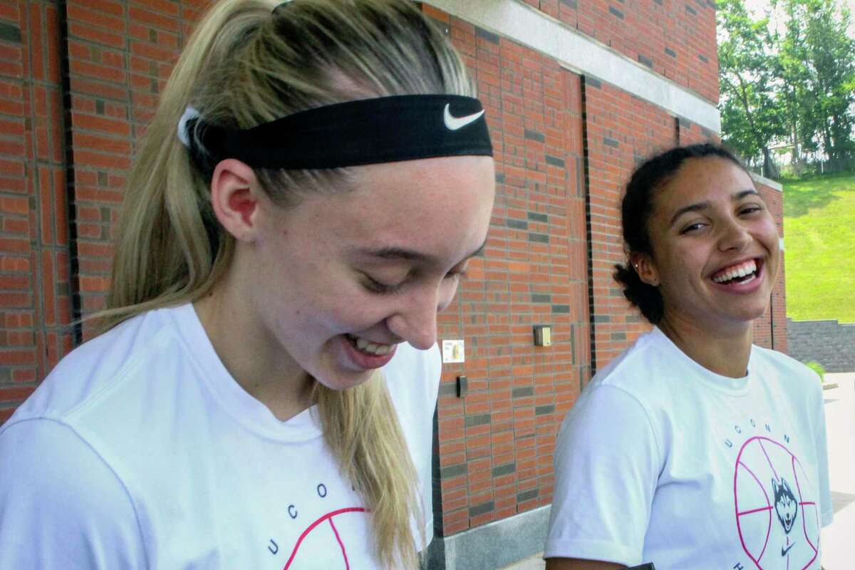UConn basketball players Paige Bueckers, left, and Azzi Fudd, right, speak to the media outside the the school's Werth basketball practice facility on Tuesday, July 6, 2021. Bueckers, last season's national player of the year, helped recruit her friend Fudd, the nation's top high school prospect. (AP Photo/Pat Eaton-Robb)