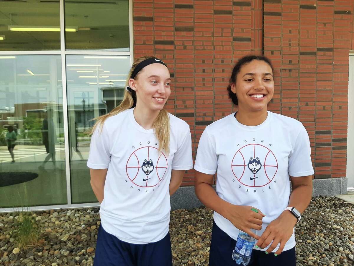 UConn sophomore Paige Bueckers, left, and freshman Azzi Fudd meet with media outside the Werth Champions Center on Tuesday, July 6, 2021 in Storrs, Conn.