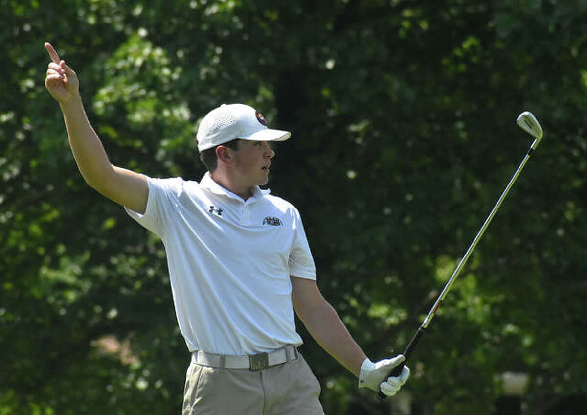 Father McGivney’s Joey Hyten signals for a possible hole-in-one during the Madison County Tournament at Belk Park Golf Course in Wood River.