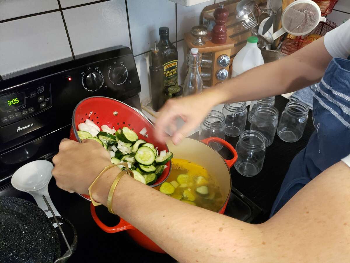 Julia Currie cooking up a batch of bread and butter pickles in Easton.