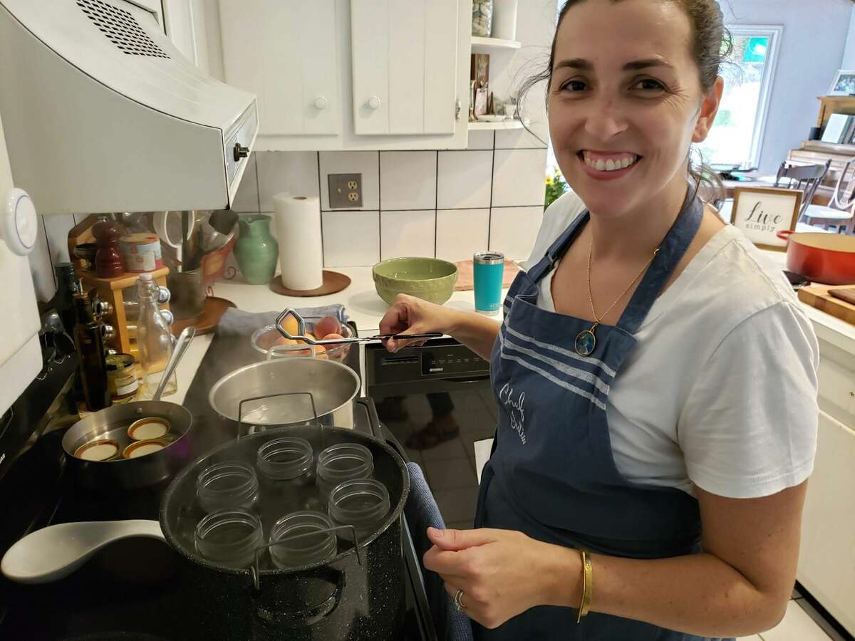 Julia Currie is busy canning late-season produce in her Easton kitchen.
