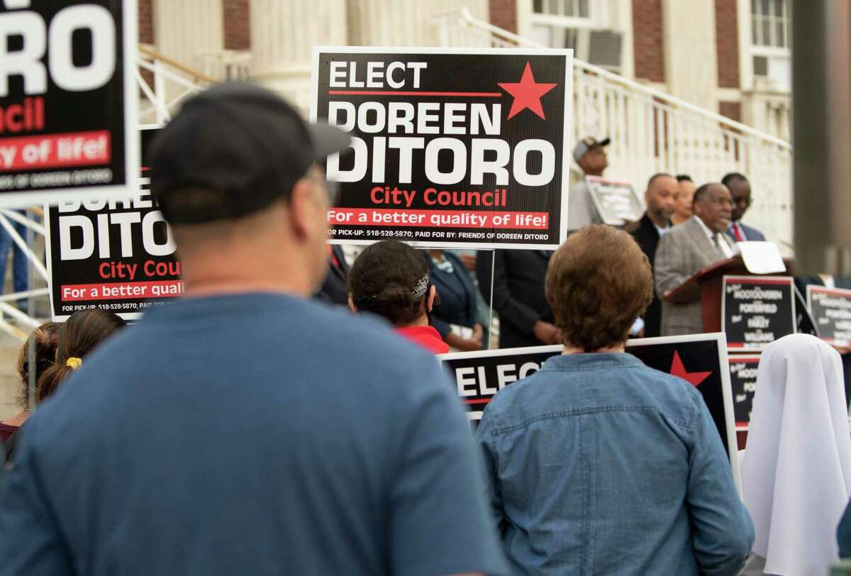 Supporters of Doreen Ditoro are seen holding signs at left as candidates for City Council hold a campaign rally serving as the rollout for the final sprint towards November's general election outside Schenectady City Hall on Monday, Sept. 27, 2021 in Schenectady, N.Y.