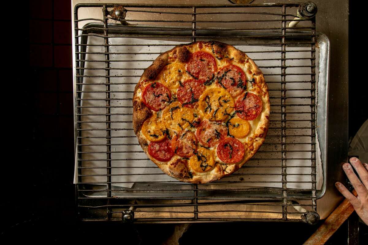 Tomato pizza from Roseland Apizza in Derby on Sept. 6, 2021.