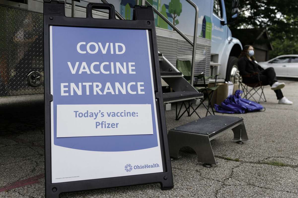 FILE -- Sign displaying the coronavirus (COVID-19) vaccine on hand at 3840 Kimberly Parkway. OhioHealths Wellness on Wheels mobile vaccine clinic visits communities with lower vaccination rates and a high social vulnerability index score to offer people free Pfizer coronavirus (COVID-19) vaccines. (Photo by Stephen Zenner/SOPA Images/LightRocket via Getty Images)