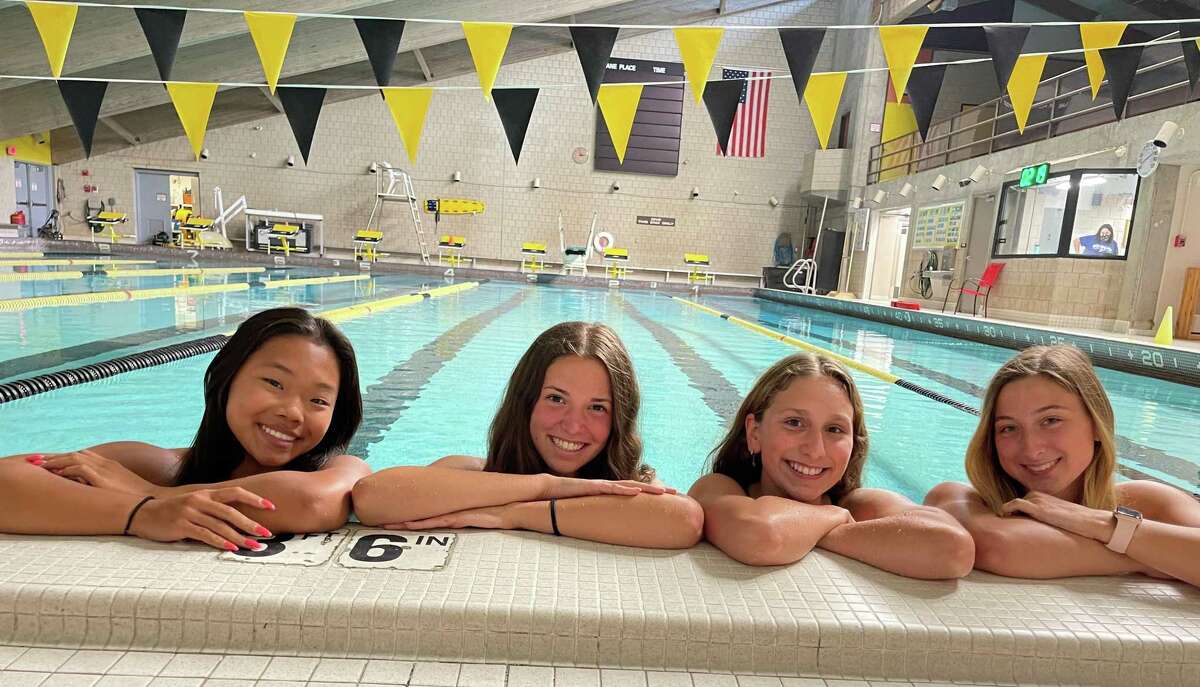 Amity’s Katie O’Connor, Taylor Dillon, Julia Snow and Lauren Sender are swim and dive team captains for coach Todd Rainey.
