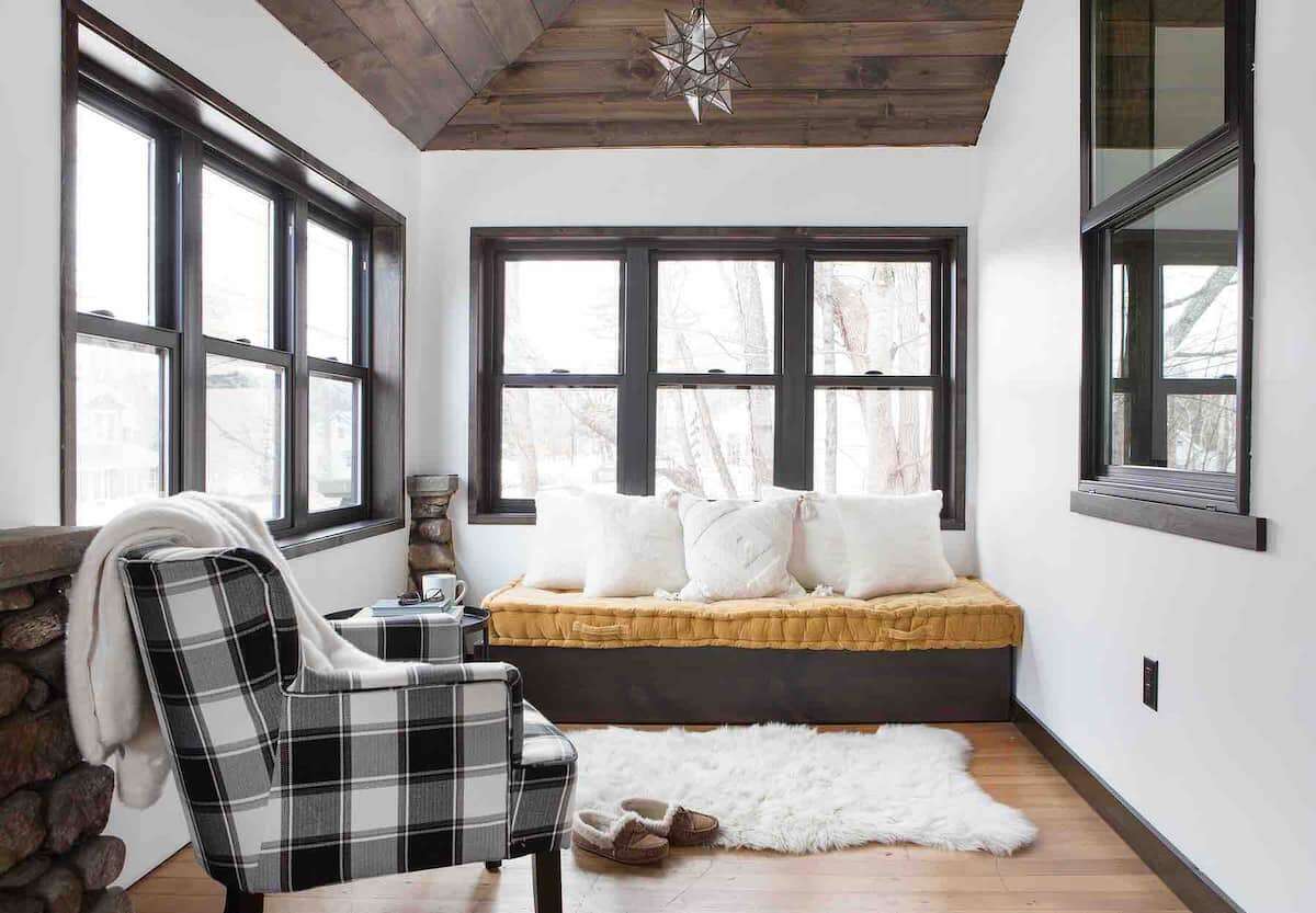 Wake up in the morning on the four season porch with dining table and day bed.