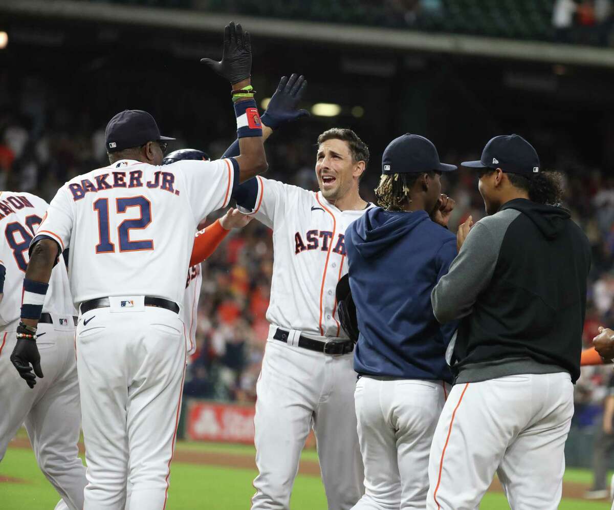 Houston Astros center fielder Jose Siri attempts to catch a fly ball by  Tampa Bay Rays' Brett Phillips during the second inning of a baseball game  Wednesday, Sept. 29, 2021, in Houston.