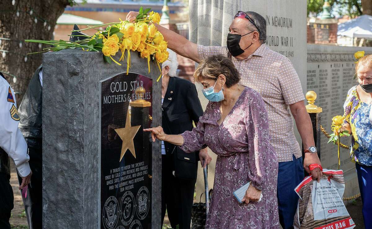 Gold Star Mothers, families and veterans gather at a monument erected in honor of the families of service members who died while serving, Saturday, Sept. 25, 2021 during an observance of Gold Star Mothers Day at Jarvis Plaza.