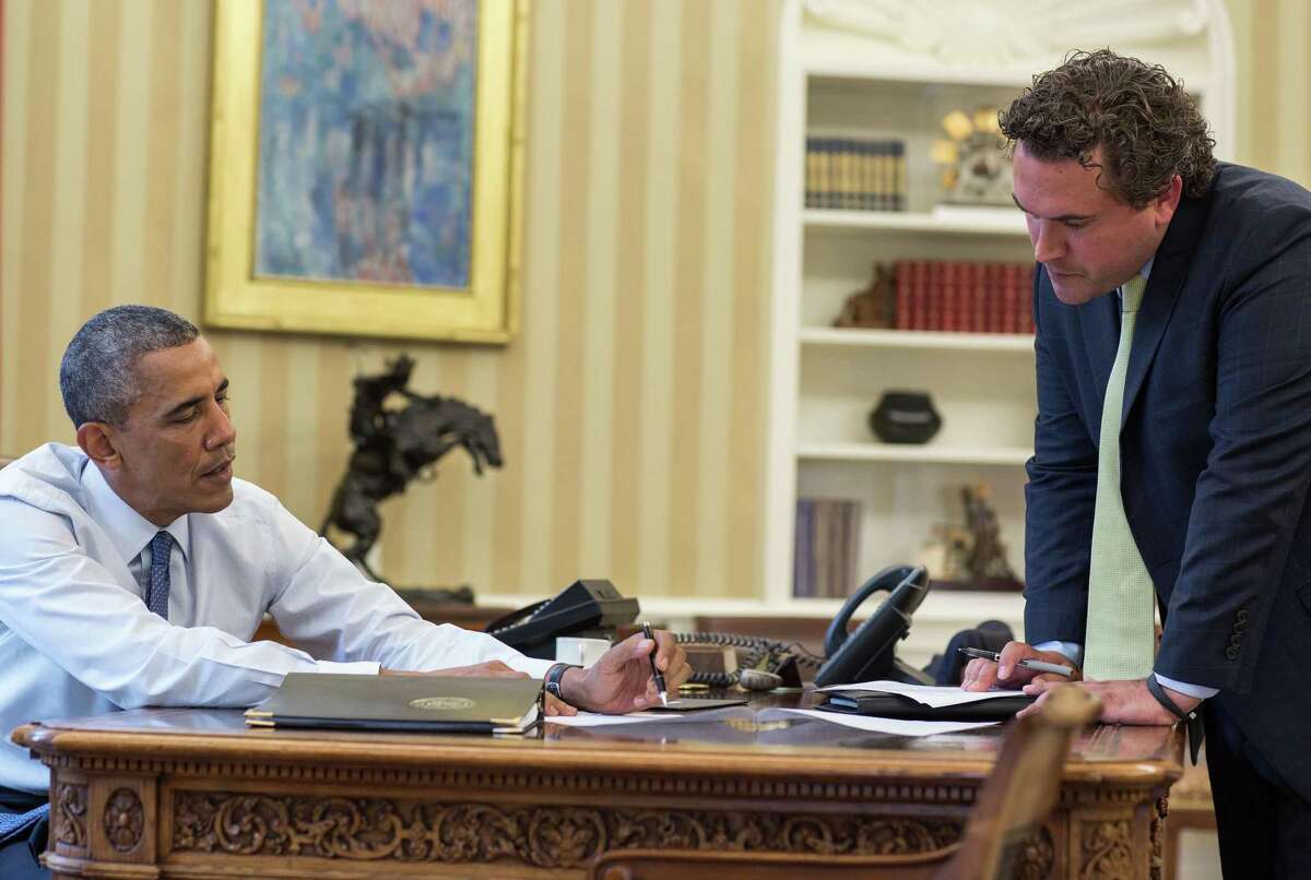 President Obama and Cody Keenan collaborate on a speech at the White House. Aug. 1, 2014.