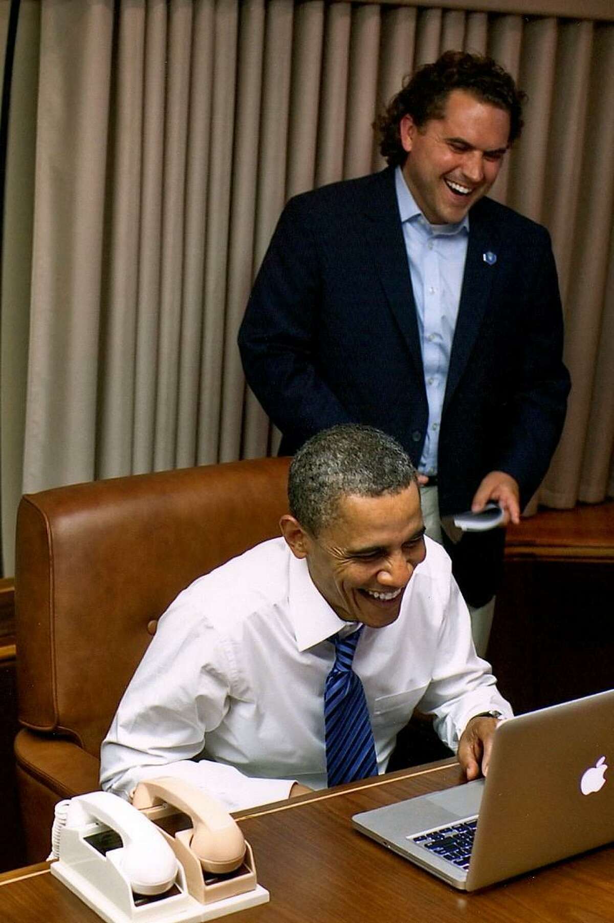 President Obama and Cody Keenan collaborate on Air Force One. April 29, 2011.