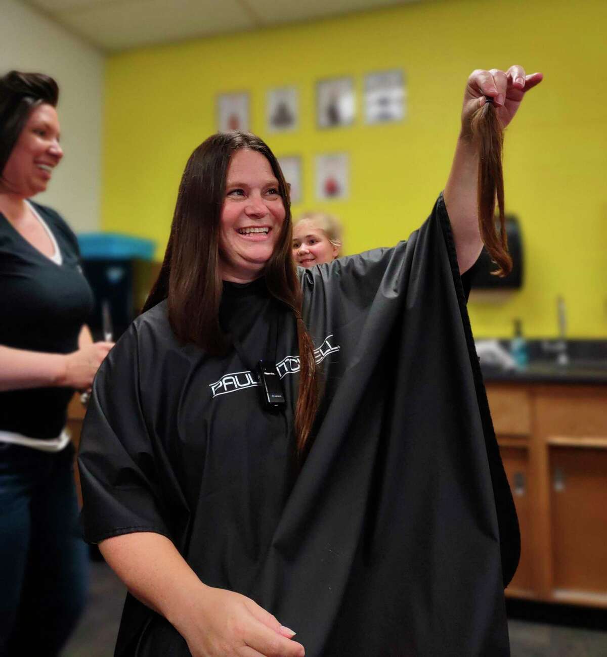 In the presence of her third-grade class, Morley Stanwood Comunity Schools elementary teacher Sarah Benson donated 10 inches of her hair to the nonprofit Children With Hair Loss. (Courtesy/Tara Lovejoy)