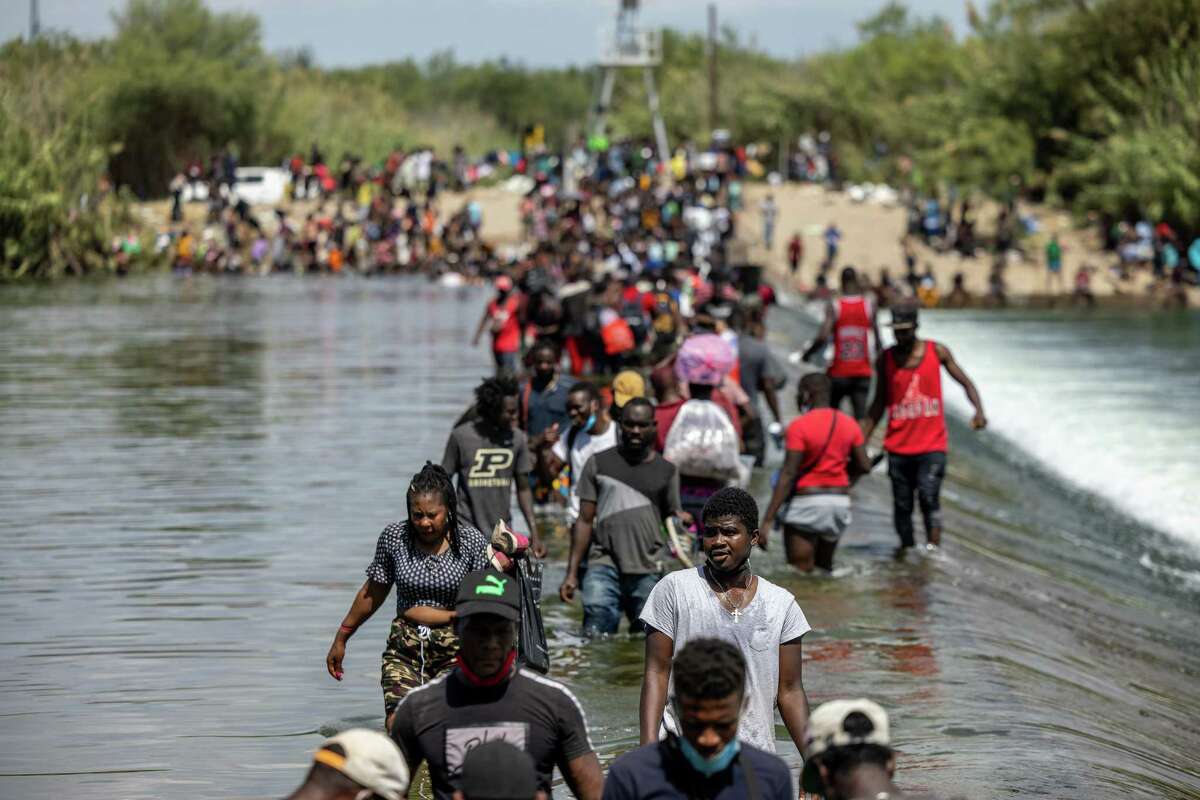 Migrants cross the Rio Grande in 2021. Federal officials and local communities fear what will happen without Title 42.