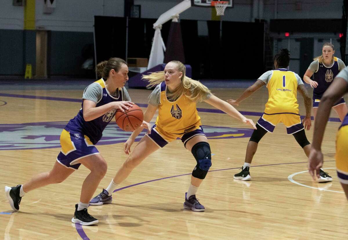 UAlbany’s Morgan Haney drives to the basket guarded by Freja Werth during a women’s basketball practice in September. Werth was named America East Rookie of the Week on Monday.