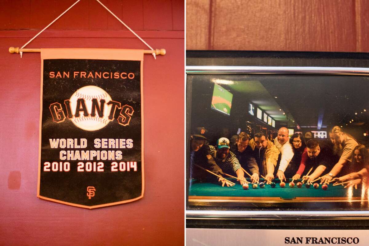 Left, a banner showing San Francisco Giants' three championships hangs on the wall and right, a picture shows one of the billiards teams that play out of Blackthorn Tavern, in San Francisco on Sept. 27, 2021.