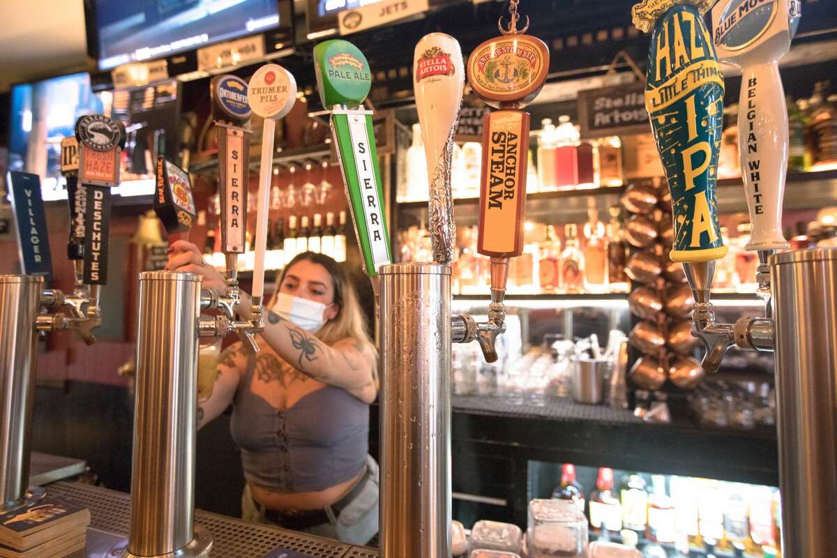 Bartender Amanda Nobrege pours a drink at Blackthorn Tavern in San Francisco on Sept. 27, 2021.