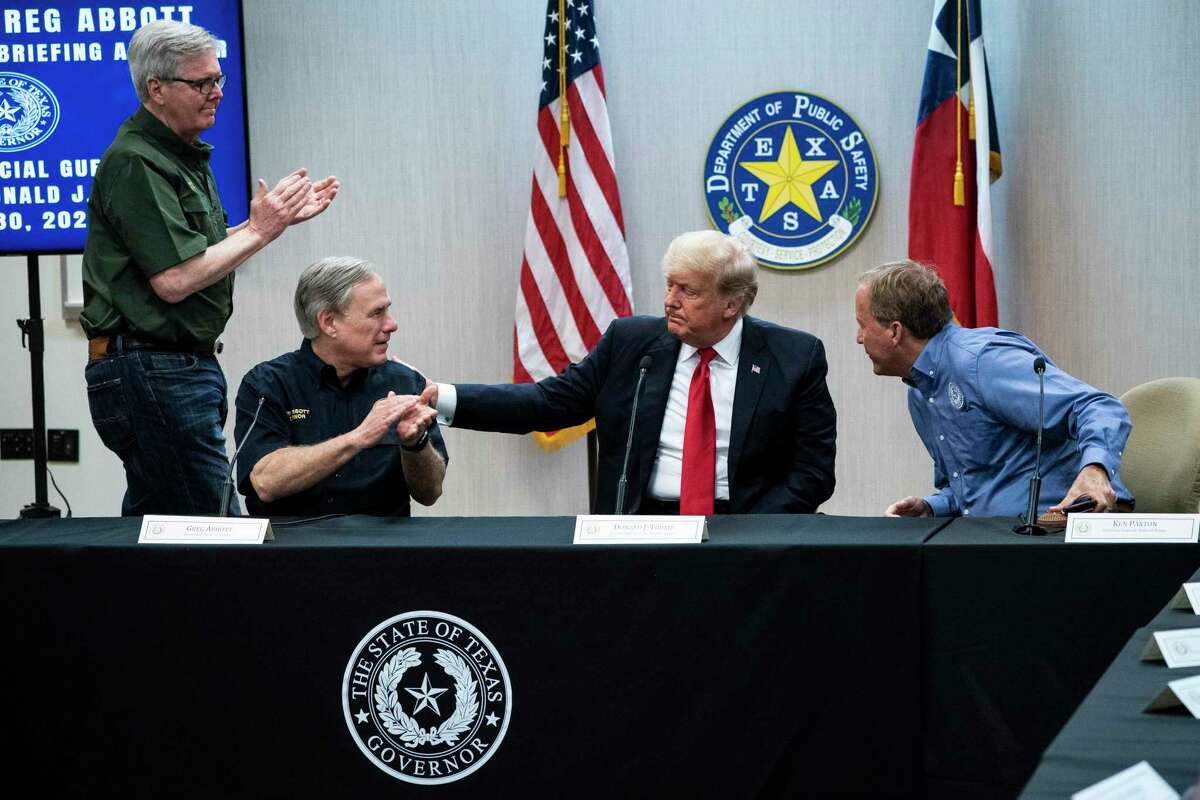 Former President Donald J. Trump and Texas Governor Greg Abbott, flanked by Texas Lt. Gov. Dan Patrick and Texas Attorney General Ken Paxton, attend a security briefing with state officials and law enforcement at the Weslaco Department of Public Safety DPS Headquarters before touring the US-Mexico border wall on Wednesday, June 30, 2021 in Weslaco, Texas. (Jabin Botsford/The Washington Post via AP, Pool)