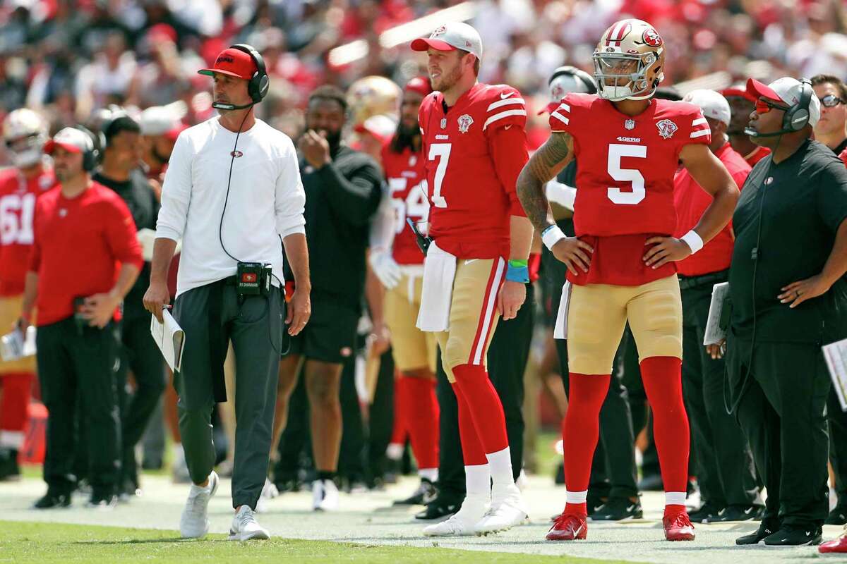 San Francisco 49ers' head coach Kyle Shanahan, Nate Sudfeld and Trey Lance watch action in 1st quarter of 34-10 win over Las Vegas Raiders during NFL preseason game at Levi's Stadium in Santa Clara, Calif., on Sunday, August 29, 2021.