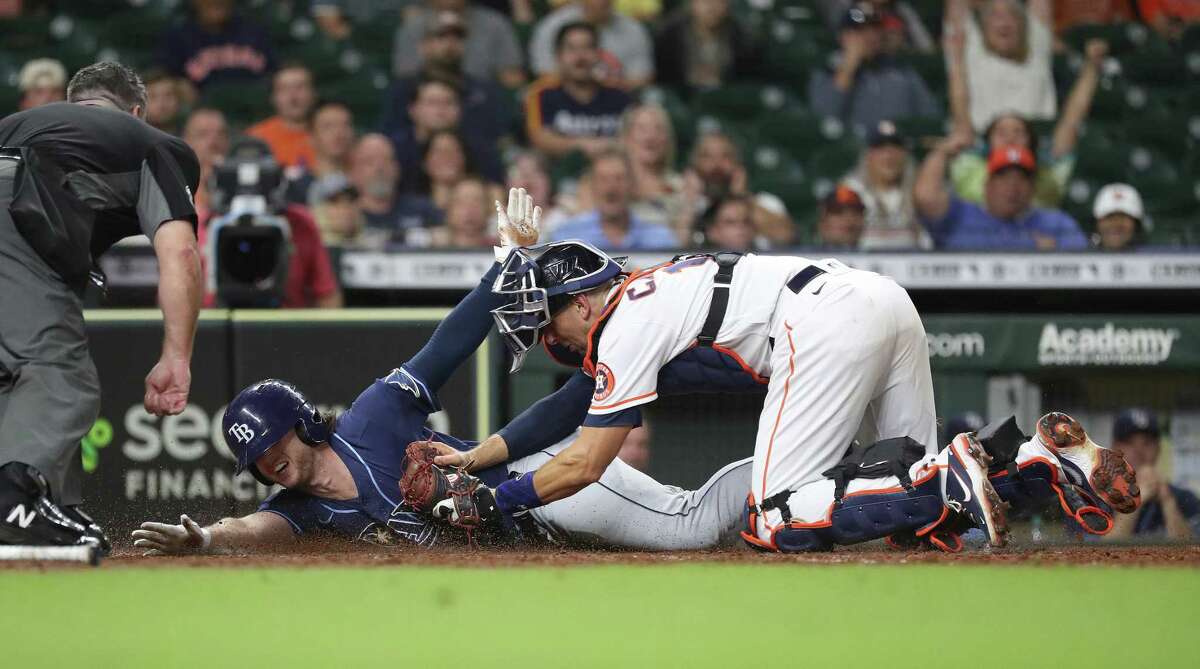 Tampa Bay Rays right fielder Brett Phillips (35) reacts after throwing a  ball to a fan before a baseball game against the Texas Rangers, Sunday,  June 6, 2021, in Arlington, Texas. Tampa