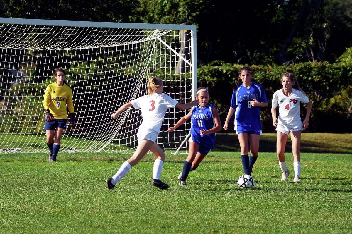 A girls high school soccer game between freshman teams from Fairfield Ludlowe and New Canaan on the soccer field on Old Dam Road in Fairfield on Wednesday.