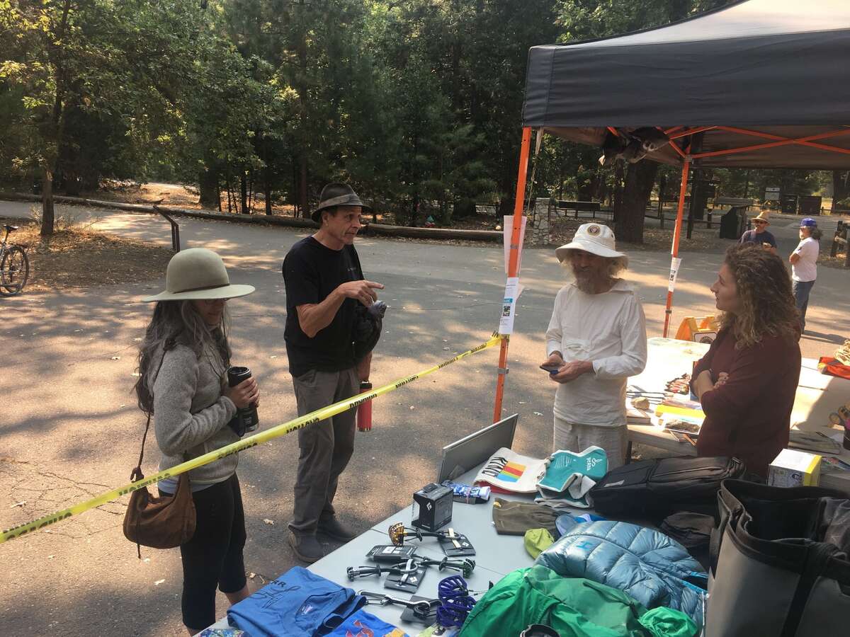 Yosemite Facelift founder Ken Yager spends time with volunteers at this year's event.